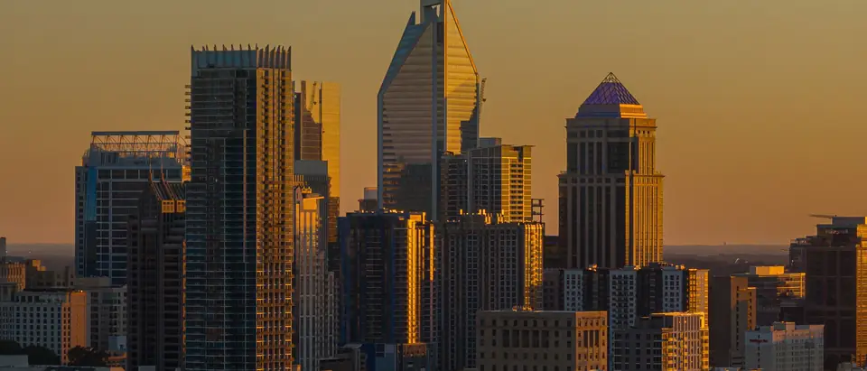 Charlotte skyline glowing at sunset